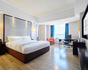 Foshan Rezen Select Pasonda Hotel - Foshan - Makuuhuone