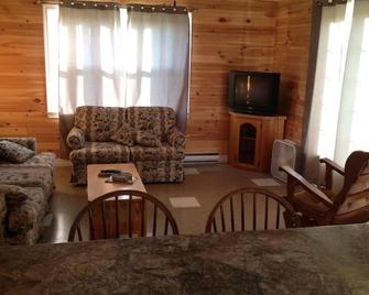 120 Two BR Cottage located on Souris River w/hot tub - Souris - Living room