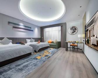 AI Stay Future Tang'an Hotel (Xi'an Longshou District Daming Palace West Subway Station) - Xi'an - Bedroom