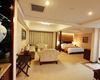 Qilu International Hotel - هاربين - غرفة نوم