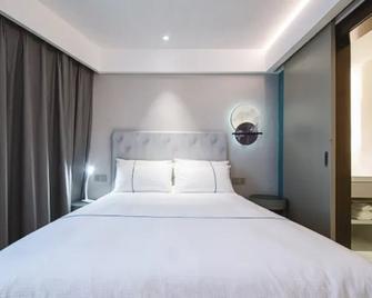 Magnotel Hotel Wuhan Jiangtan Lihuangpo Road Pedestrian Street - Wuhan - Habitación