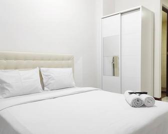 Simply Homey Studio at Vida View Apartment By Travelio - Makassar - Bedroom