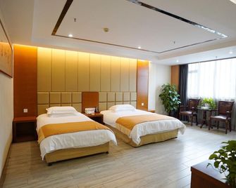 Double Dragon Holiday Hotel(Anqing Railway Station) - Anqing - Bedroom