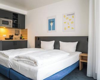 أبارتمنتس أن دير كو - دوسيلدورف - غرفة نوم