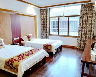 Qijiayi Theme Hostel No.2 Shop - Zhangjiajie - Bedroom