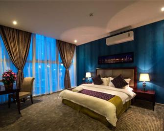 تالين الأحساء للأجنحة الفندقية - الهفوف - غرفة نوم