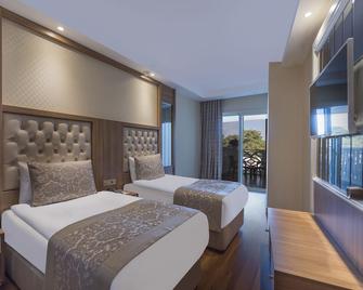 Oz Hotels Sui - Okurcalar - Bedroom