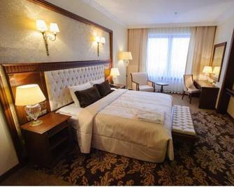 President Hotel - Minsk - Schlafzimmer
