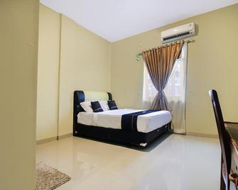 OYO 2659 B'rasco Homestay Syariah - Duri - Habitación