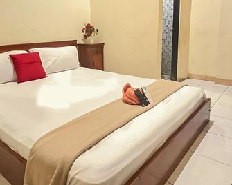 Akavi Homestay Jayapura Redpartner - Jayapura - Schlafzimmer