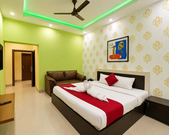 Goroomgo Padoshi Puri - Puri - Schlafzimmer