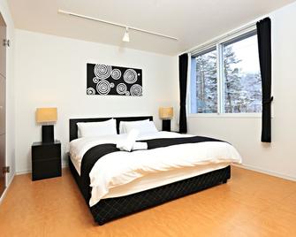 Hakuba Echo Hotel and Apartments - Hakuba - Bedroom