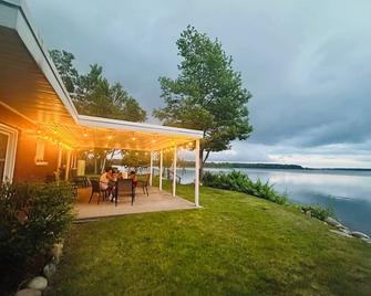 New Listing! Spacious 4-Bedrooms Lake Front Retreat In Delightful Alpena Area. - Alpena - Patio