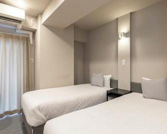 Tabist Unihotel Midosuji Hommachi - Osaka - Bedroom