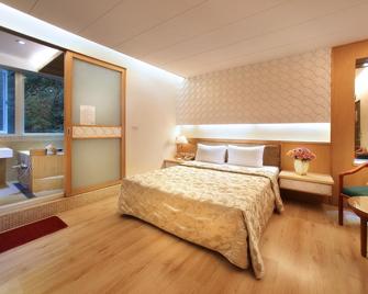 Green City Hotel - Ren-ai Township - Bedroom
