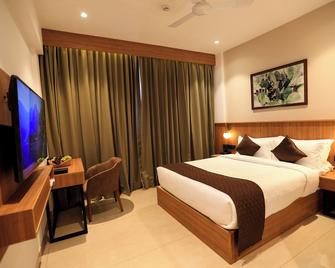 Hotel Saffron Wayanad - Sultan Bathery - Slaapkamer