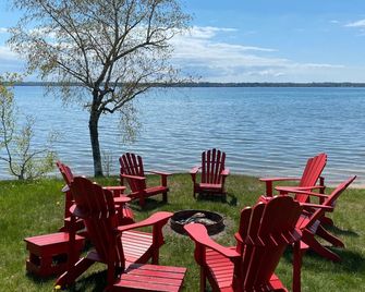 Torch Lake Family Friendly Lakefront Home - Prime Summer Weeks Available - Central Lake - Patio