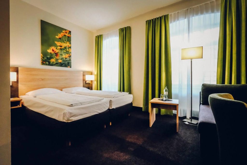 Hotel Europa - במברג - חדר שינה