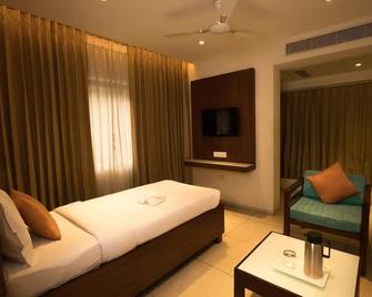 Gayathri Hotel - Tiruppur - Slaapkamer