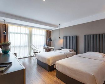 Zaixu Hotel - Wuhan - Habitación