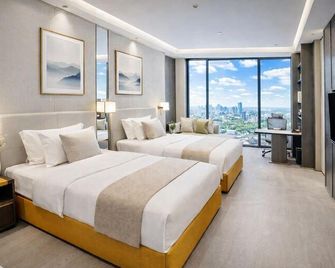 Shangrao Hongshi Dynasty International Hotel (Xincheng Wuyue Plaza) - Shangrao - Kamar Tidur