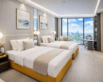 Shangrao Hongshi Dynasty International Hotel (Xincheng Wuyue Plaza) - Shangrao - Schlafzimmer