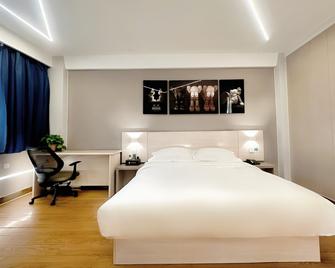 7 Days Premium Hotel Kaifeng Songcheng Road Jingxi - Kai Feng - Camera da letto