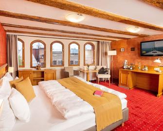 رومانتيك هوتل شيلهوف - سترالسوند - غرفة نوم