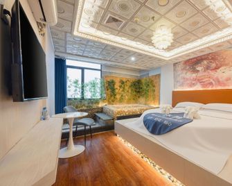 18 Yun Boutique Hot Spring Hotel (Wuzhou Wangcheng Plaza Branch) - Wuzhou - Bedroom