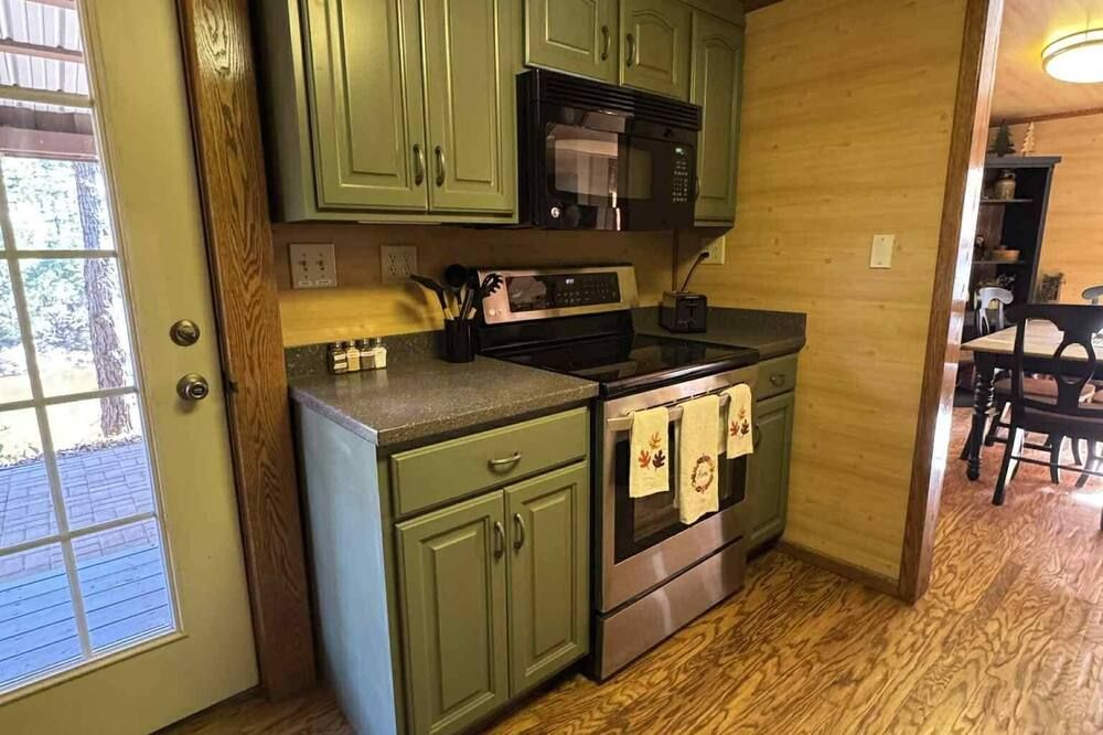 Pine Oaks Cabin includes Guest Pole Barn. Modern comfort meets county living.