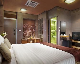 Amos Cozy Hotel Melawai - Yakarta - Habitación