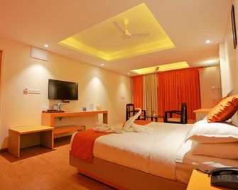 Grand Signature Hotel & spa - Yercaud - Schlafzimmer