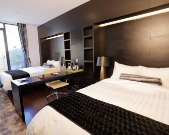 The One Boutique Hotel - קווינס - חדר שינה