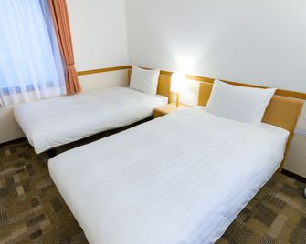 Toyoko Inn Sasebo Ekimae - Сасебо - Спальня