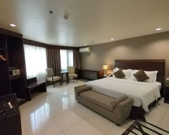 Mandarin Plaza Hotel - סבו סיטי - חדר שינה