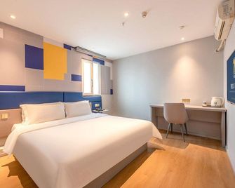 7 Days Inn Guangzhou Xinshi Branch - גואנגג'ואו - חדר שינה