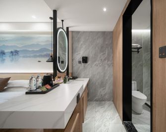 Tupaiya Hotel (Jingzhou Jiangjin East Road Olympic Sports Center Branch) - Jingzhou - Schlafzimmer
