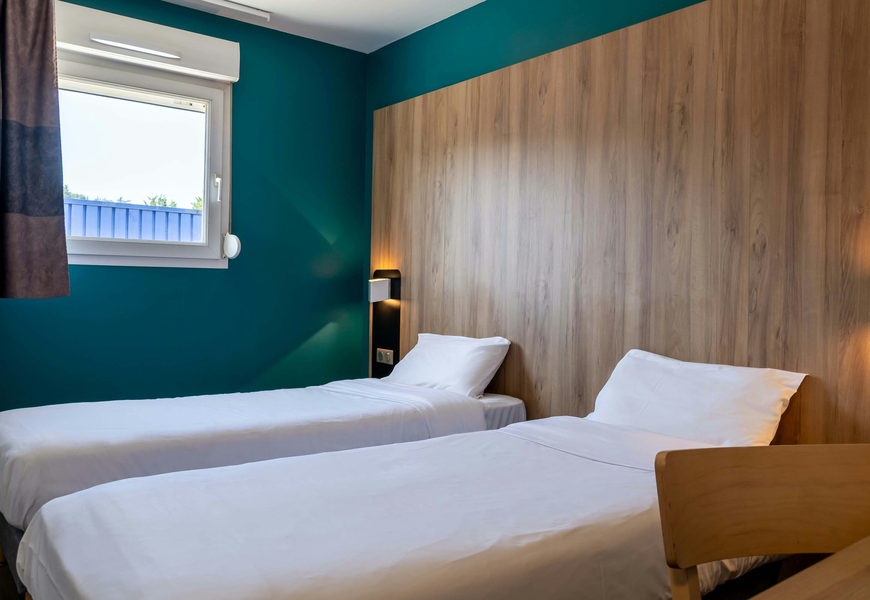 B&B HOTEL Saint-Etienne Monthieu - סנט-אטיין - חדר שינה