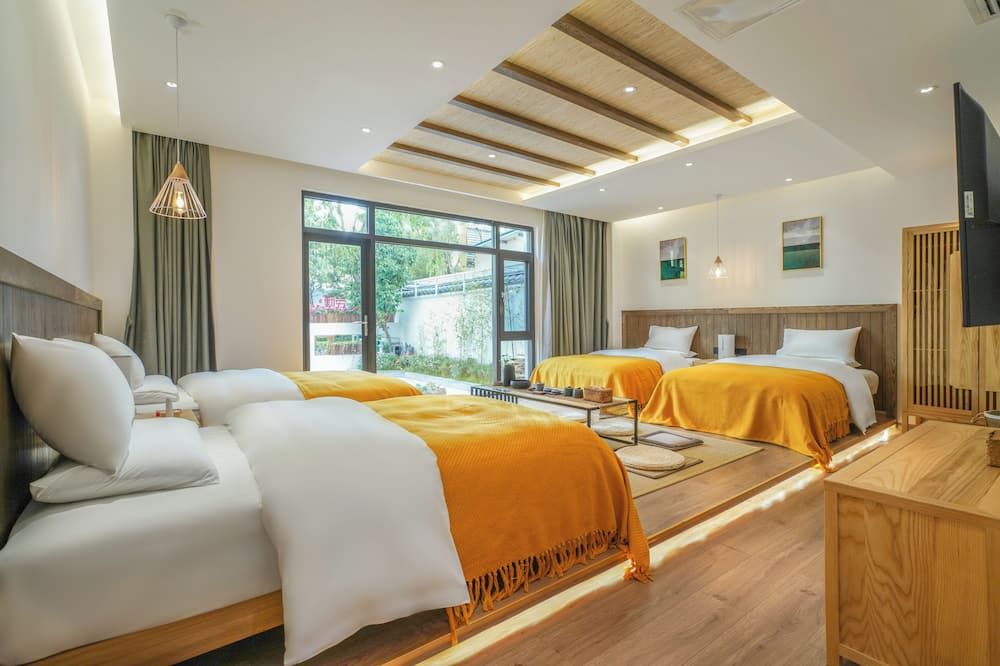 Xisu Garden Inn - ליז'יאנג - חדר שינה