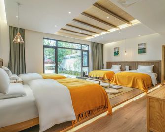 Xisu Garden Inn - ליז'יאנג - חדר שינה