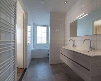 Design apartment in Zeeland with its own wellness - Colijnsplaat - Baño