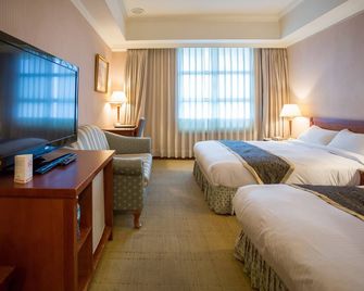 Grand Boss Hotel - אילאן סיטי - חדר שינה