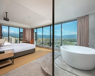 Vienna International Hotel Xichang Qionghai Wetland Wanda Plaza - Liangshan - Bedroom