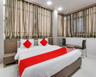 OYO Hotel Parishram Inn - Hālol - Bedroom