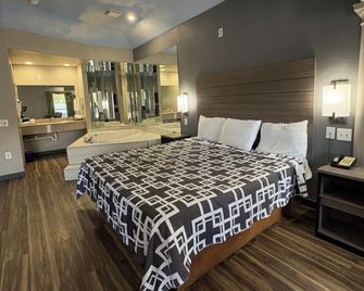 Regency Inn & Suites by Capital O Houston Iah Airport - Humble - Soveværelse