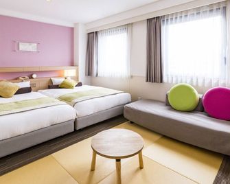 شين أوساكا ستيشن هوتل - أوساكا - غرفة نوم