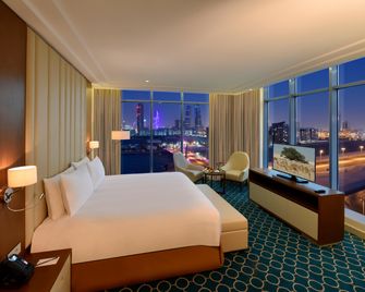 Grand Swiss-Belhotel Waterfront Seef - Sanabis - Bedroom