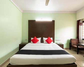 Capital O 63523 Hotel Palika - Hassan - Slaapkamer