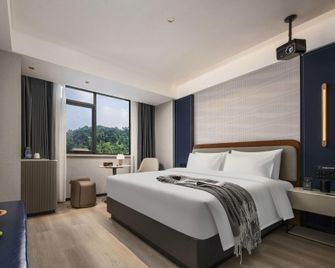 Huanman Hotel (Yiyang Avenue Jinshan Road Branch) - Yiyang - Slaapkamer