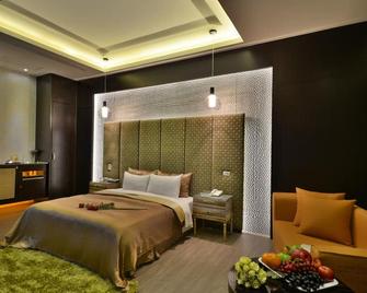 Xiadu Motel - טאיצ'ונג - חדר שינה